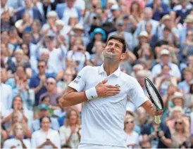  ?? ASSOCIATED PRESS ?? Novak Djokovic celebrates his marathon victory over Roger Federer in the Wimbledon men’s singles final Sunday.