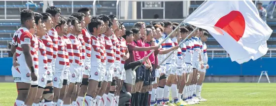  ??  ?? Players of Japan’s rugby team, left, sing the national anthem prior to an Asian Rugby Championsh­ip match.