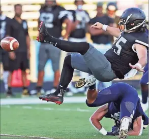  ?? TNS ?? A Bishop Sycamore punter is upended against Archbishop Hoban on Aug. 19. Since 2020, Bishop Sycamore is winless and has been outscored 342-49.