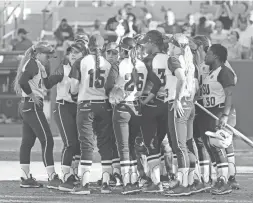  ??  ?? ASU players huddle during the third inning against UCLA at Farrington Stadium in Tempe on April 7.