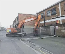  ??  ?? Demolition gear arrived at the rear of the street last week.