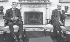  ?? SAUL LOEB/AFP VIA GETTY IMAGES ?? In a post-meeting statement Monday, House Speaker Kevin Mccarthy, left, and President Joe Biden called their talks productive. But “we’re not there yet,” Mccarthy said Tuesday at the Capitol, reiteratin­g he won’t bring any bill forward “that doesn’t spend less than we spent this year.”