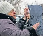  ?? ?? GRIEF: Residents of Kharkiv share their grief amid the latest deadly Russian drone strike.