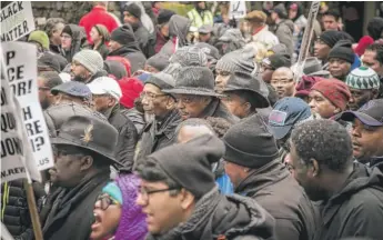  ??  ?? U.S. Rep. Bobby Rush and the Rev. Jesse Jackson (center) were among hundreds at protests Friday along Michigan Avenue over the police shooting of 17-year-old Laquan McDonald.