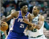  ?? THE ASSOCIATED PRESS FILE ?? Al Horford, right, defends Joel Embiid. The pair will be teammates after Horford agreed to a free-agent deal with the 76ers.