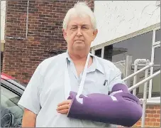  ?? Pictures: BNPS ?? Driving instructor Chris Barnett with his fractured elbow in a sling after his car door was slammed on him by an angry motorist