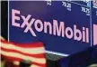  ?? Richard Drew/Associated Press ?? Exxon Mobil, logo seen on the trading floor of the New York Stock Exchange, failed to file a report of released methane.