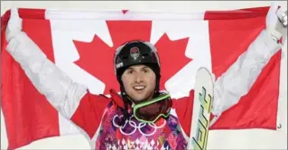  ?? ANDY WONG, THE ASSOCIATED PRESS ?? Canada’s Alex Bilodeau celebrates after winning the gold medal in the men’s moguls final at the 2014 Winter Olympics.