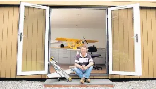  ??  ?? Adrian Hazeldine with his garden room in Prestbury