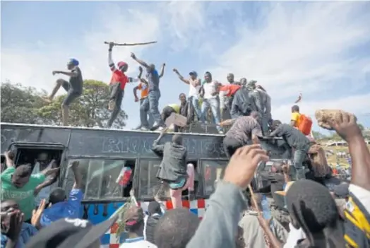  ??  ?? POPULAR UPRISING: Supporters of opposition leader Raila Odinga gather for his mock swearing-in ceremony at Uhuru Park in Nairobi on Tuesday.