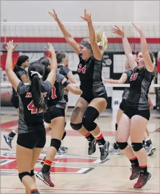  ?? Katharine Lotze/The Signal (See additional photos on signalscv.com) ?? Hart’s girls volleyball team celebrates a point over Valencia during a volleyball game on Tuesday.