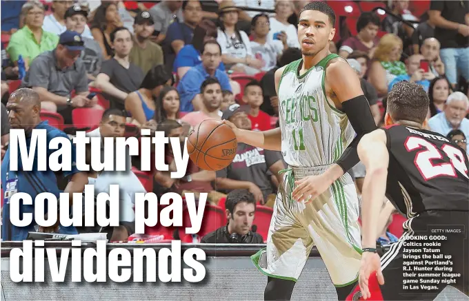  ?? GETTY IMAGES ?? LOOKING GOOD: Celtics rookie Jayson Tatum brings the ball up against Portland’s R.J. Hunter during their summer league game Sunday night in Las Vegas.
