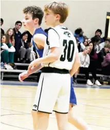  ?? ?? Starkville Christian’s Hayes Carver (30) looks to see action in the lane during Tuesday’s game against Fayette Christian Academy. (Photo by Danny P. Smith, SDN)