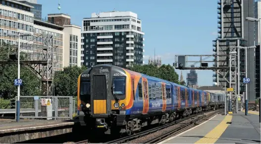  ?? ALEX DASI-SUTTON. ?? On June 22, South Western Railway 450011 and 450111 pass Vauxhall with the 1053 London Waterloo-Alton. Performanc­e on SWR has deteriorat­ed since it replaced South West Trains, however Wolmar says he would have more faith in managers of either franchise when it comes to solving the problems on the Wessex route, rather than the rail regulator.