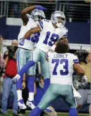  ?? MICHAEL AINSWORTH — THE ASSOCIATED PRESS ?? Dallas Cowboys wide receiver Amari Cooper (19) celebrates his touchdown against the Philadelph­ia Eagles in overtime of an NFL football game, in Arlington, Texas, Sunday.