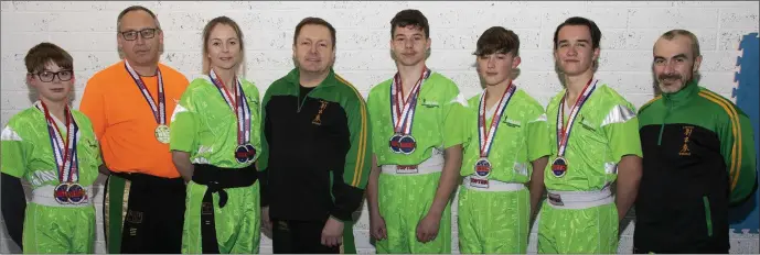  ??  ?? The members of Wexford Kung Fu and Kickboxing Club who were successful in the U.S.A. (from left): Nathan Casserly, Pat Monahan (referee), Michelle Casserly, Bobby O’Neill (coach), Cathal Moran, Adam Tierney, Eoghan Dempsey, Mark Rowe (coach).