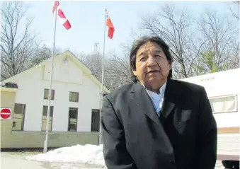  ?? PAUL MORDEN ?? Maynard T. George stands Tuesday outside a trailer blocking the entrance of Pinery Provincial Park. He and other members of his family say the park is part of a large tract of land owned by their ancestors.