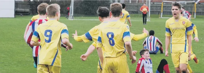 ??  ?? Scarboroug­h Athletic Under-15s celebrate scoring during their 3-3 draw at home to Hull Kingston Tigers Pictures by Andy Standing
