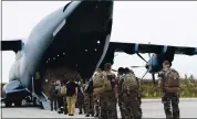  ?? FRENCH DEFENSE MINISTRY VIA AP ?? French soldiers prepare to board a military Airbus A400M to evacuate French citizens from Afghanista­n on Monday.