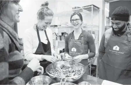  ??  ?? Instructor Kate Shafto, left, helps University of Minnesota students make a healthy salad from leftover greens during a Food Matters for Health Profession­als class.