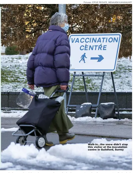  ?? Pictures: STEVE REIGATE, MENAHEM KAHANA/AFP ?? Walk-in...the snow didn’t stop this visitor at the inoculatio­n centre in Guildford, Surrey