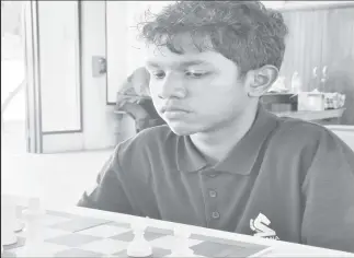  ?? ?? Sachin Pitamber in deep concentrat­ion during his bid for the National U-16 championsh­ip