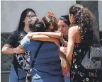  ?? AP ?? Relatives of passengers of a missing military plane comfort each other as they arrive at the Cerrillos airbase in Santiago, Chile, on Tuesday.