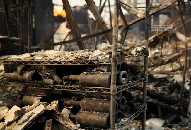  ??  ?? charred wine bottles sit on a rack in what’s left of signorello’s tasting room