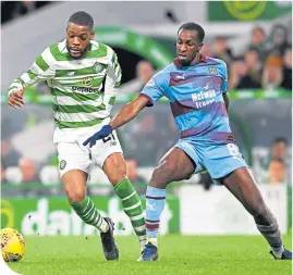  ??  ?? Olivier Ntcham and Dundee’s Glen Kamara in action