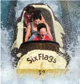  ??  ?? Timber! A log flume ride in the U.S.