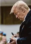  ?? Associated Press file photo ?? President Donald Trump signs a Bible in 2019 in Smiths Station, Ala. Because that’s what the good word was lacking.