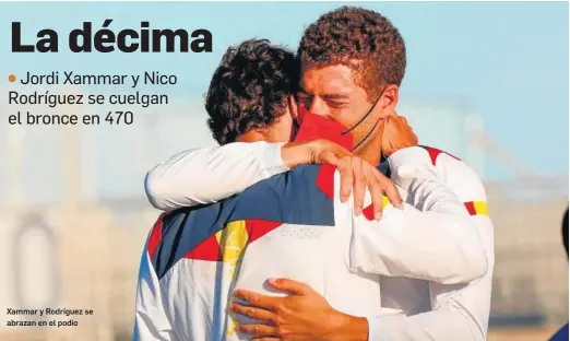  ?? ENRIC FONTCUBIER­TA / EFE ?? Xammar y Rodríguez se abrazan en el podio