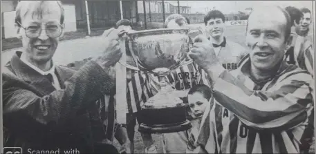  ??  ?? Pat Hayes presents Alan ‘Jacko’ Newsome with the Hills of Arklow Wicklow Cup after the 1995 final against Gorey Rangers.