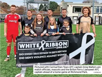  ?? CARMDAS ?? Pictured with Carmarthen Town AFC captain Greg Walters are match officials, mascots and the Briton Ferry Llansawel AFC captain ahead of a home game at Richmond Park.