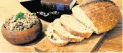  ?? Miami Herald file ?? Dark crusty bread with butter, such as these loaves from Zak the Baker in Miami, are most likely what Sheah Rarback's Jewish grandfathe­r ate in Poland. It's a healthy way to start the day, she writes.