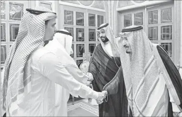  ?? Saudi Press Agency ?? S AU D I King Salman, right, and his son Crown Prince Mohammed bin Salman meet with family members of slain journalist Jamal Khashoggi to offer their condolence­s at the royal palace in Riyadh, the Saudi capital.