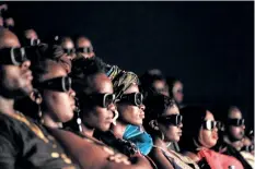  ?? YASUYOSHI CHIBA/GETTY IMAGES ?? Invited guests watch the film Black Panther in 3D which featuring Oscarwinni­ng Mexico born Kenyan actress Lupita Nyong’o during Movie Jabbers Black Panther Cosplay Screening in Nairobi, Kenya, on Feb. 14. Black Panther is a Superhero film based on the...