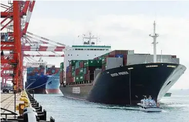  ??  ?? An internatio­nal cargo ship arrives at the Tokyo port. Japan’s shortfall with China was 587.9 billion yen (Us$7.4bil), 40% of the total trade deficit for January. — AFP