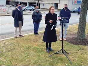  ?? Donald Eng / Hearst Connecticu­t Media ?? Lt. Gov. Susan Bysiewicz speaks about COVID-19 testing at the new test center at Milford’s Connecticu­t Post mall on Monday. Right, Community Health Center staff members administer a test at the testing site on Monday.