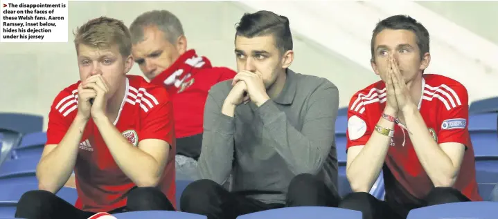  ??  ?? > The disappoint­ment is clear on the faces of these Welsh fans. Aaron Ramsey, inset below, hides his dejection under his jersey