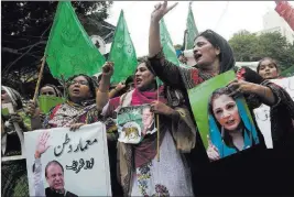  ?? Shakil Adil ?? The Associated Press Supporters of deposed Pakistani Prime Minister Nawaz Sharif rally in favor of their leader Thursday in Karachi, Pakistan. The Supreme Court disqualifi­ed thriceelec­ted Sharif for concealing assets.