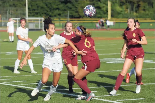  ?? Ned Gerard / Hearst Connecticu­t Media ?? Trumbull’s Sophia Lowenburg, left, tangles with St. Joseph’s Caroline Sheehan during Thursday’s game.