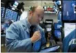  ?? RICHARD DREW — THE ASSOCIATED PRESS ?? Trader Peter Mancuso works on the floor of the New York Stock Exchange, Tuesday.