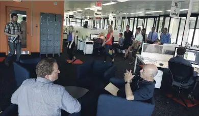  ?? CLIFFORD SKARSTEDT EXAMINER ?? Operations and event co-ordinator Alana Dall leads a tour of The Cube new business incubator during the Peterborou­gh and the Kawarthas Innovation Cluster’s sold-out annual general meeting on Thursday.