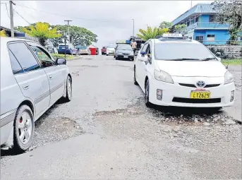  ?? Picture: JONA KONATACI ?? Mayoral Drive in Valelevu, Nasinu needs repair.