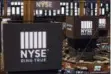  ?? RICHARD DREW — THE ASSOCIATED PRESS FILE ?? Screens above trading posts on the floor of the New York Stock Exchange show the NSE logo.