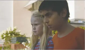  ?? IFC FILMS ?? Rakel Lenora Fløttum, left, and Sam Ashraf portray kids whose playing turns deadly in The Innocents.