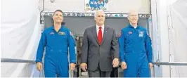  ?? RED HUBER/ORLANDO SENTINEL ?? Vice President Mike Pence, center, with NASA astronaut Reid Wiseman, left, and Patrick Forrester, NASA Chief astronaut, as they walk out of crew headquarte­rs in 2017 at the Kennedy Space Center. Pence will visit the Space Coast on Tuesday for a SpaceX launch.