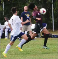  ?? Photos by Ernest A. Brown ?? Woonsocket senior Hezekiah Adeyeye (13) had a pair of assists to help the Villa Novans defeat visiting Blackstone Valley Prep 4-3 in a Division III clash Friday afternoon at Barry Field.