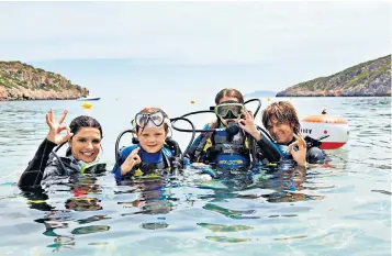  ?? ?? We’re OK: older children can go scuba diving at Daios Cove